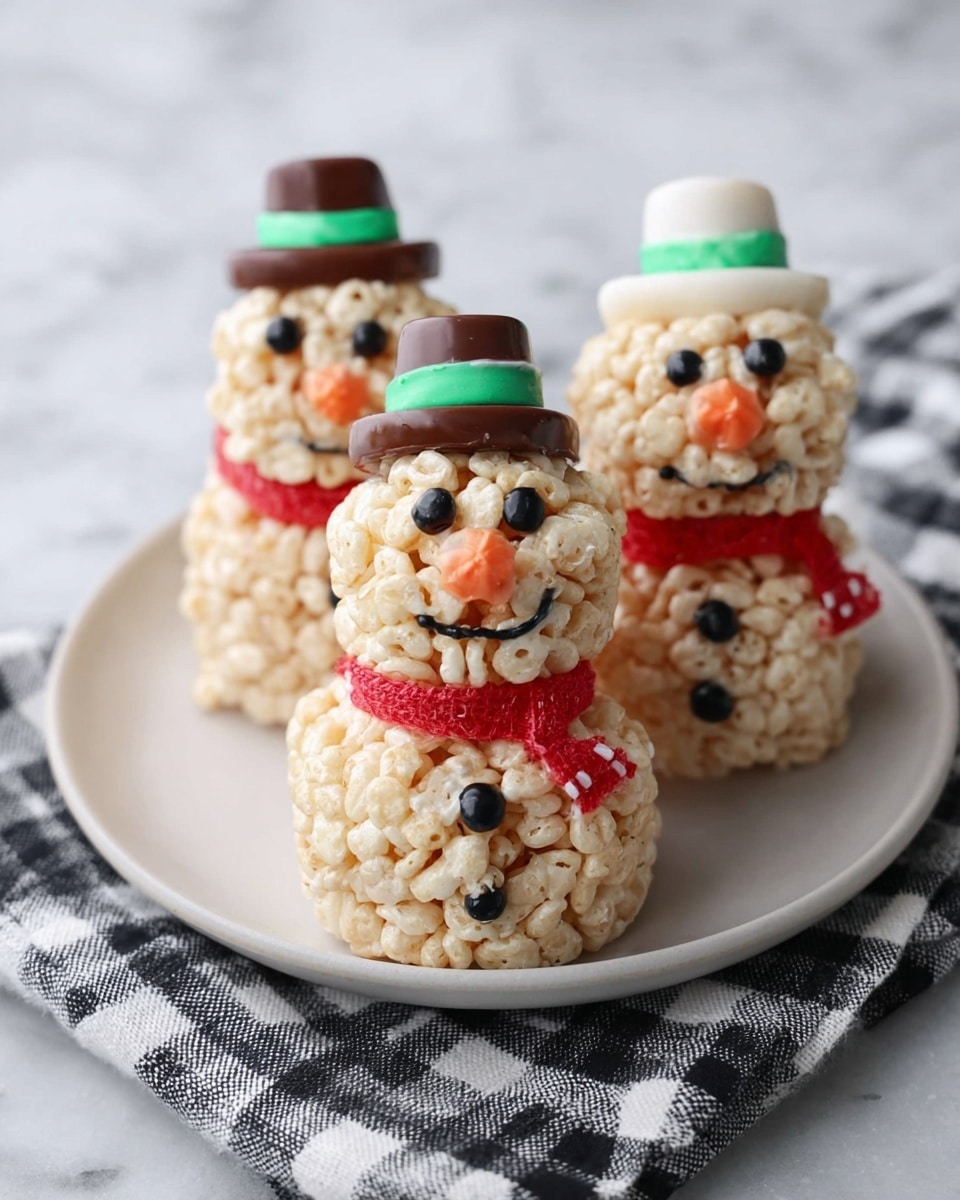 Three snowman-shaped treats made of light beige puffed rice cereal are placed on a round white plate, which sits on a black-and-white checkered cloth on a white marbled surface. Each snowman has two stacked puffed rice balls: a larger bottom ball and a smaller top ball. Around the neck of each snowman is a red candy belt that looks like a scarf. The eyes are made of small, round, dark brown candies, and the nose is a small, round, orange candy. Each snowman has three buttons on the bottom ball made of red and green round candies. On top, each snowman wears a small hat made of a layered brown cookie, a white round layer, and a green ribbon in between. The surface and lighting show a bright and clear image, captured up close. photo taken with an iphone --ar 4:5 --v 7