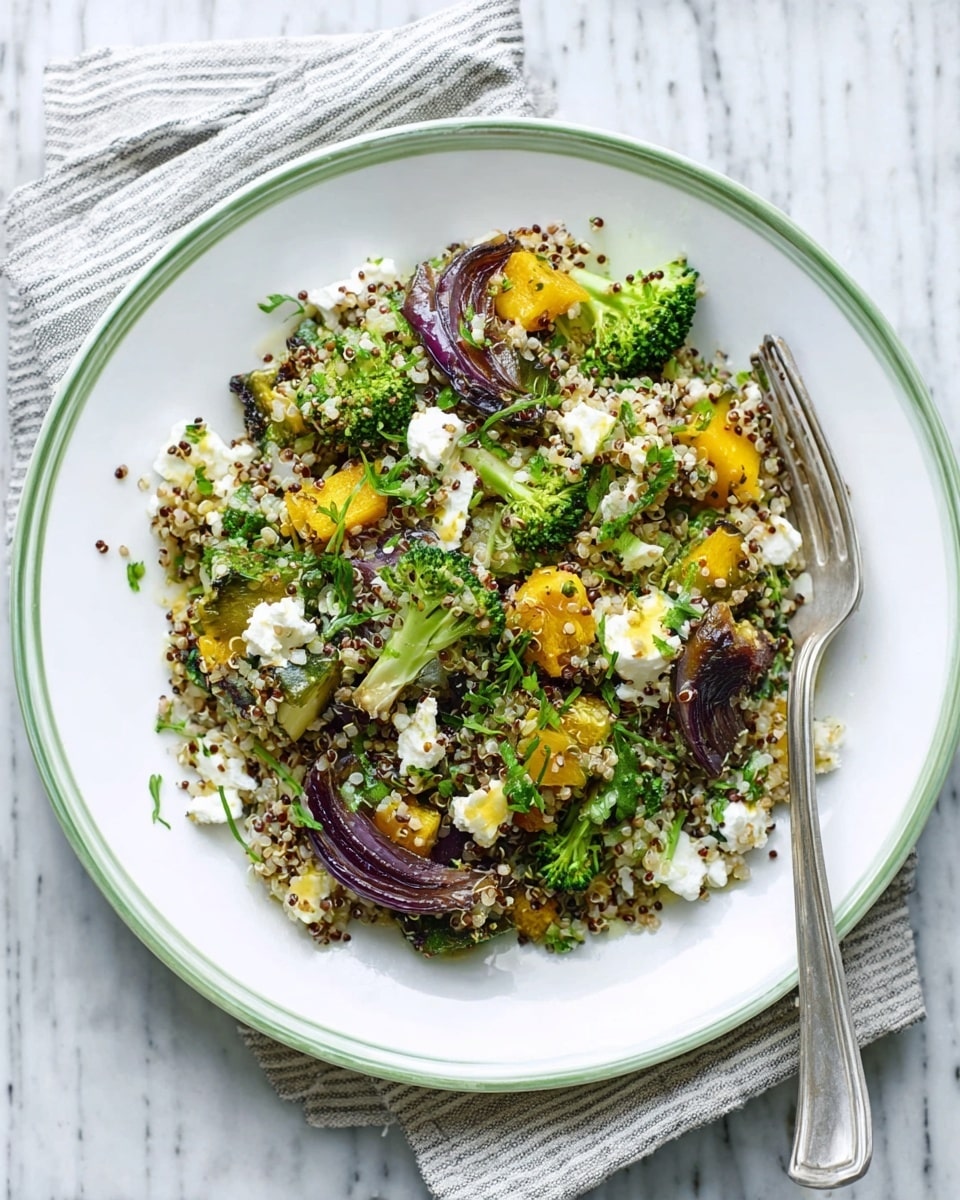 A white plate with a thin green edge holds a colorful salad made of several layers. The base layer is a mix of small grains in beige and brown tones. Scattered on top are bright green broccoli florets and chunks of golden yellow roasted squash. There are pieces of roasted purple onion adding a deep color contrast, along with small white chunks of cheese spread unevenly. Fresh green herbs are sprinkled over the salad. A silver fork rests on the left edge of the plate, all placed on a white marbled surface with a light blue striped cloth underneath. photo taken with an iphone --ar 4:5 --v 7