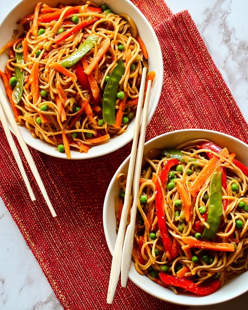 Two white bowls filled with stir-fried noodles are placed on a white marbled surface with an orange woven mat partially underneath them. Each bowl contains three main layers: a base of light brown noodles, mixed with thin orange carrot sticks and bright green peas, topped with red bell pepper slices scattered throughout. A pair of light-colored chopsticks rests on the edge of each bowl, with one pair held by a woman's hand gently picking up some noodles and vegetables. The colors of the vegetables stand out vividly against the noodles and white bowls, creating a fresh and vibrant look. Photo taken with an iphone --ar 4:5 --v 7