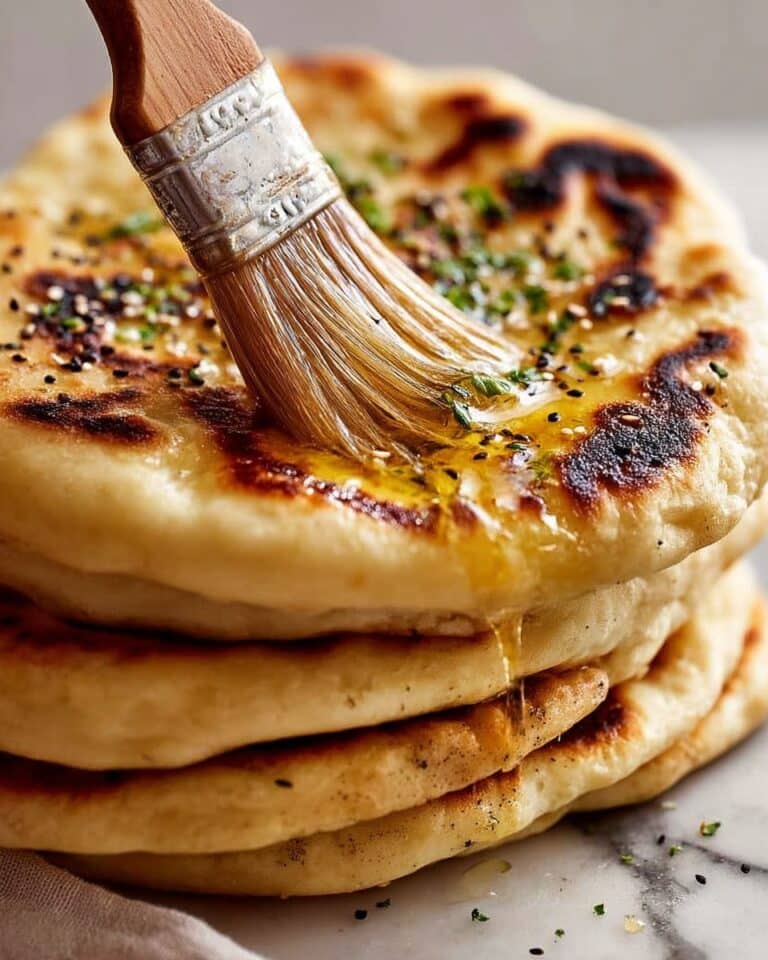Fluffy, Chewy Naan Bread with Garlic, Cheese, and Nigella Seeds Recipe